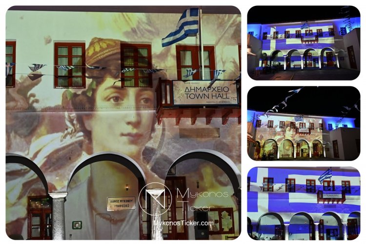 Independence Day in Mykonos: Με τα χρώματα της ελληνικής σημαίας και την ηρωϊκή μορφή της Μαντούς Μαυρογένους φωταγωγήθηκε το Δημαρχείο Μυκόνου